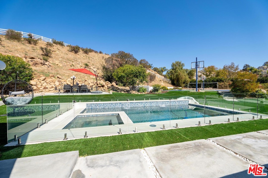 129 Saddlebow Road Bell Canyon, CA 91307 - Photo 19 of 39 a view of swimming pool with a yard