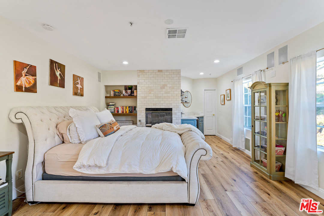 129 Saddlebow Road Bell Canyon, CA 91307 - Photo 26 of 39 a living room with furniture and a fireplace