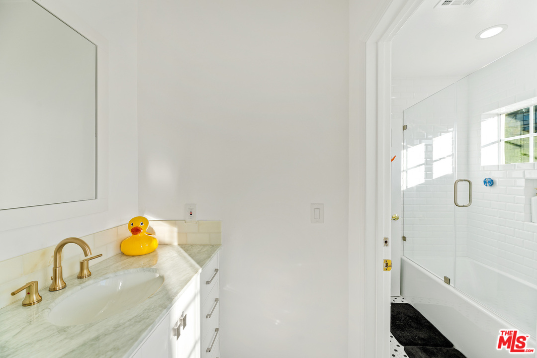 129 Saddlebow Road Bell Canyon, CA 91307 - Photo 32 of 39 a bathroom with a sink and a shower