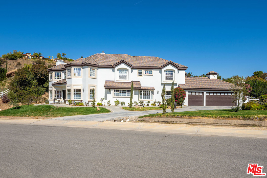 129 Saddlebow Road Bell Canyon, CA 91307 - Photo 35 of 39 a front view of a house with a yard