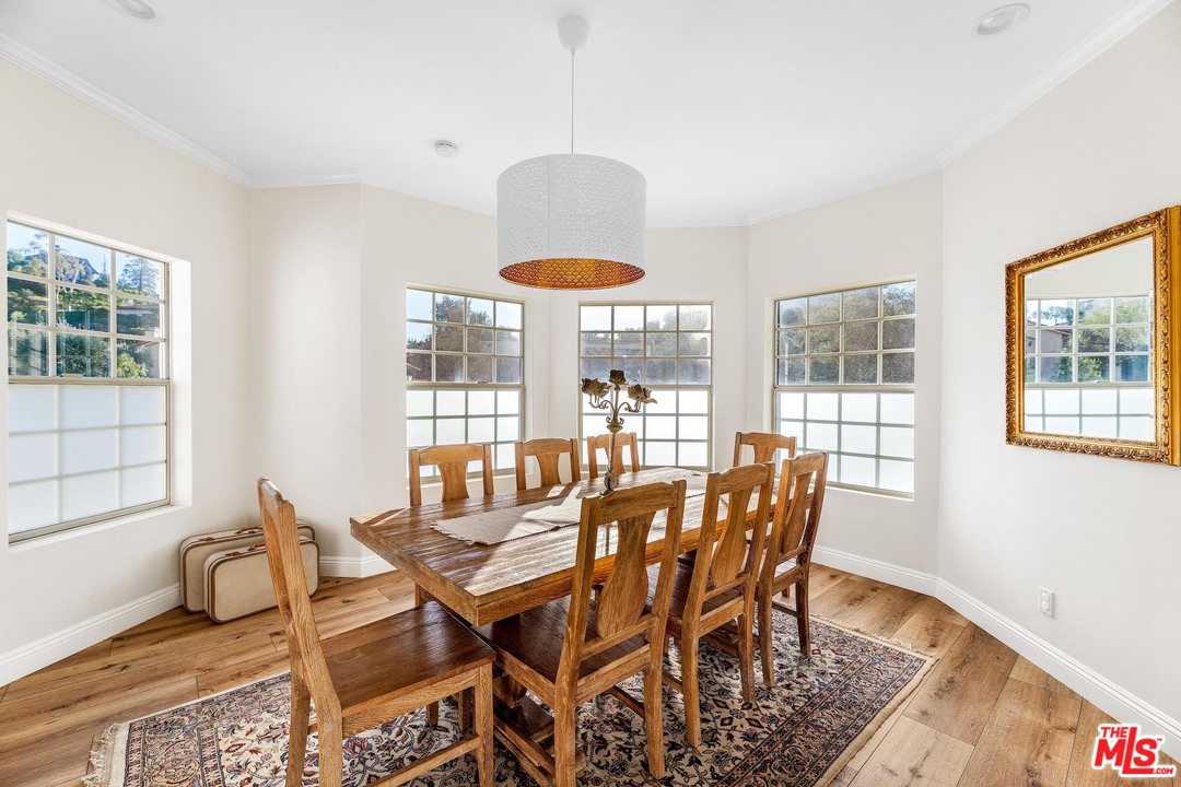 129 Saddlebow Road Bell Canyon, CA 91307 - Photo 6 of 39 a dining room with furniture a chandelier and wooden floor