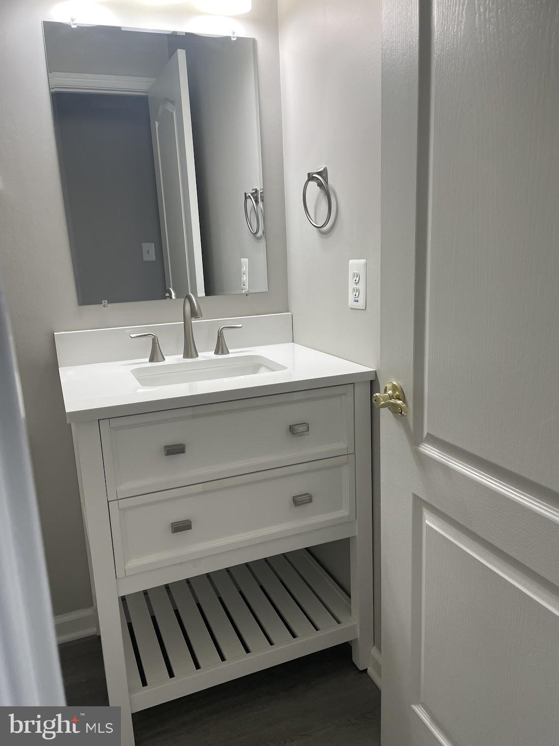 8343 Montgomery Run Road Ellicott City, MD 21043 - Photo 34 of 36 Sleek modern bathroom vanity design.