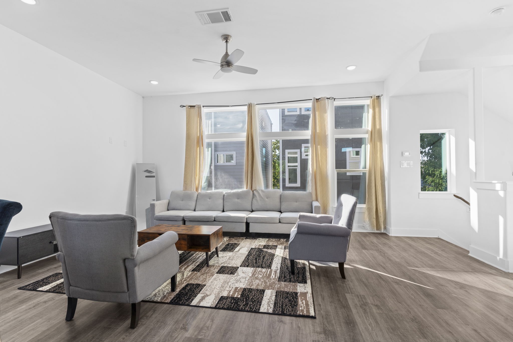 4017 Ward Street Houston, TX 77021 - Photo 14 of 45 Open living area with large windows and a warm, inviting feel.