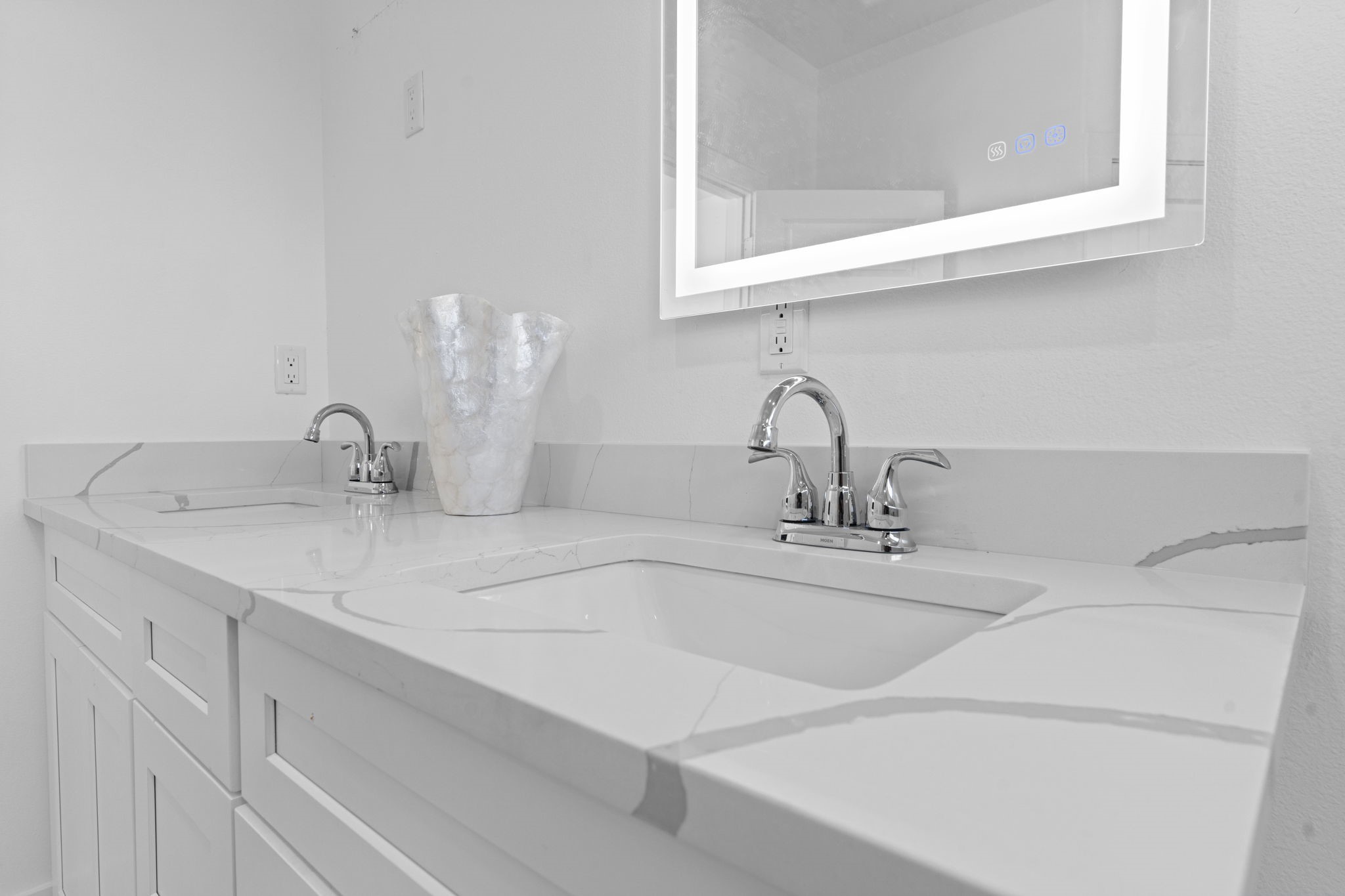 4017 Ward Street Houston, TX 77021 - Photo 30 of 45 Elegant quartz countertops paired with dual sinks for a sleek modern look.