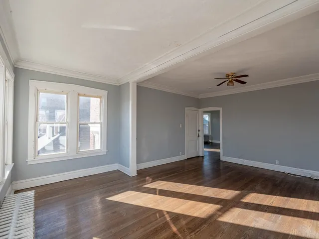a white refrigerator freezer and a stove sitting inside of a kitchen