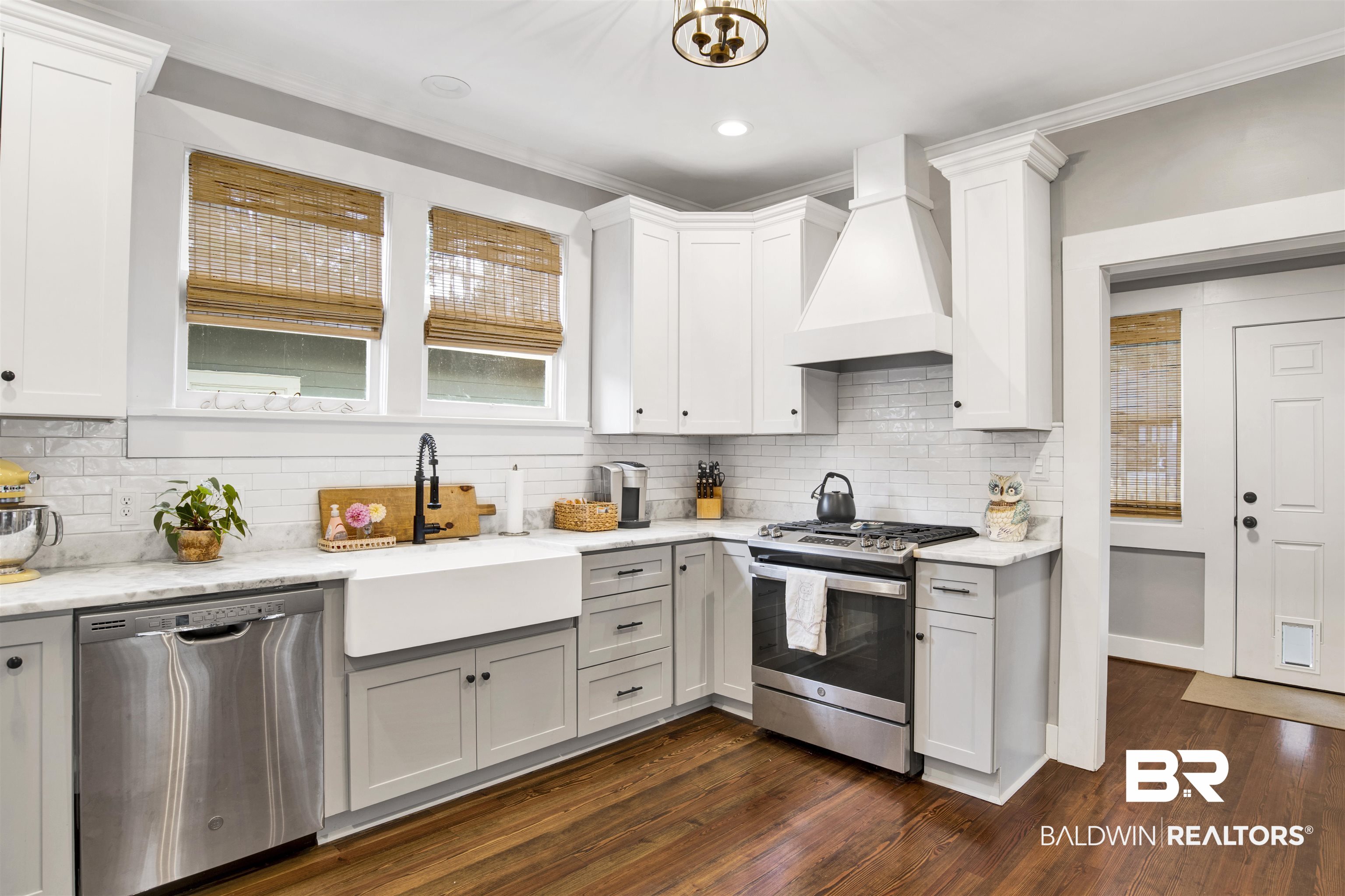 123 Macy Place Mobile, AL 36604 - Photo 11 of 35 Kitchen with stainless steel appliances, light stone counters, white cabinets, crown molding, and recessed lighting