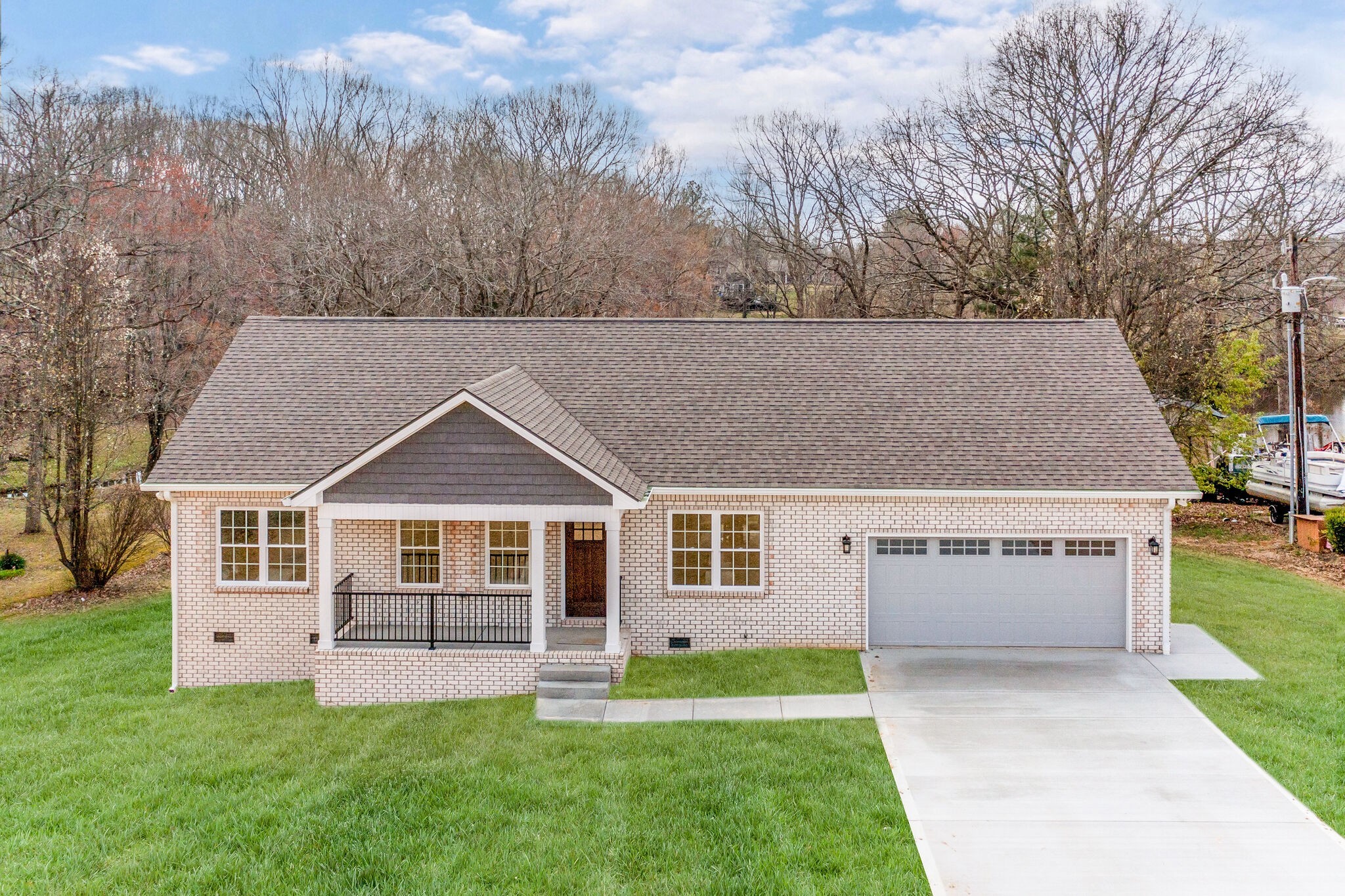 580 Lakeview Court Tennessee Ridge, TN 37178 - Photo 2 of 30 a front view of a house with a yard and trees