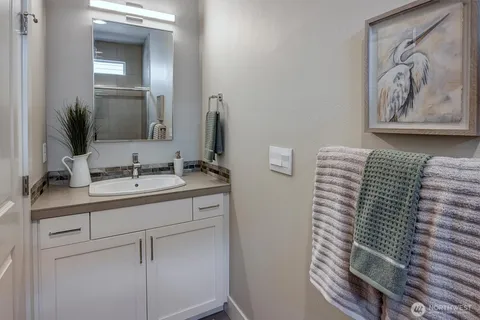 a bathroom with a sink and a mirror