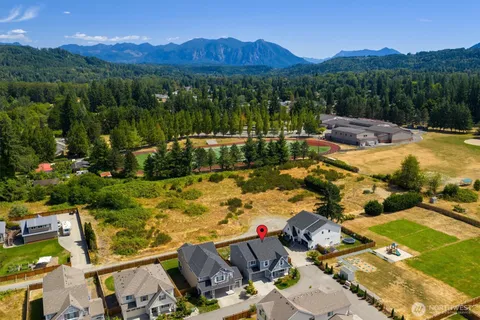 an aerial view of residential houses with outdoor space