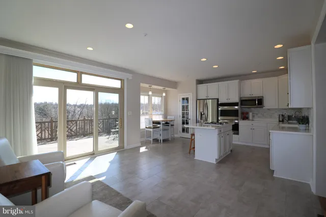 a kitchen with a sink stainless steel appliances and cabinets