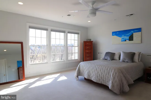 a view of a hallway with wooden floor and entryway