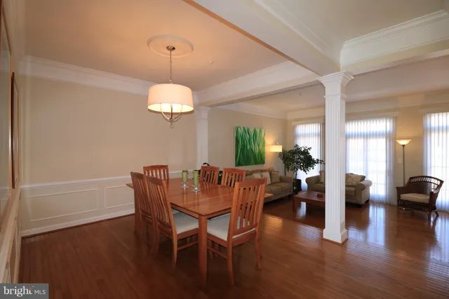 a view of a hallway with chandelier fan