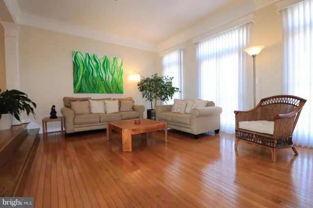 a living room with furniture and a table