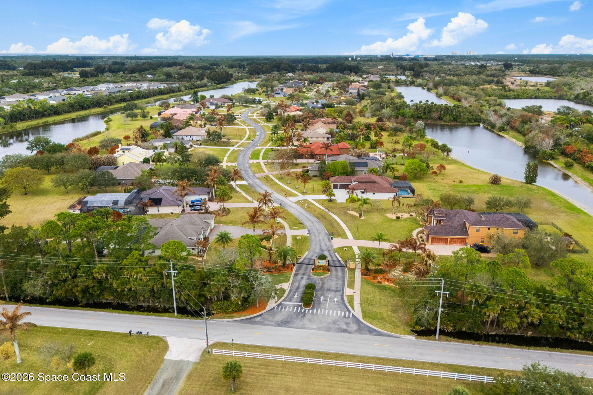 5137 Royal Paddock Way Merritt Island, FL 32953 - Photo 103 of 132 an aerial view of residential houses with outdoor space and swimming pool