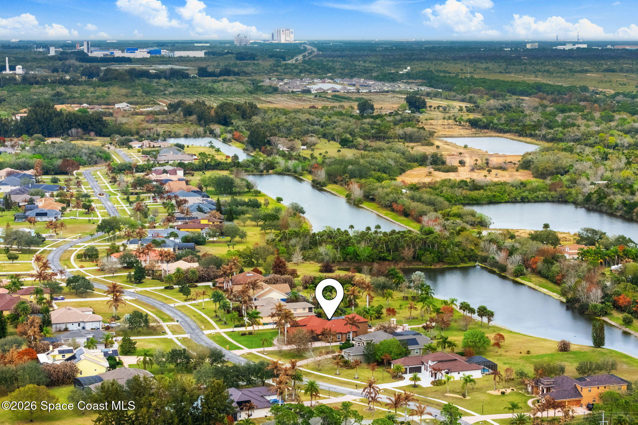 5137 Royal Paddock Way Merritt Island, FL 32953 - Photo 124 of 132 an aerial view of residential houses with outdoor space and lake view