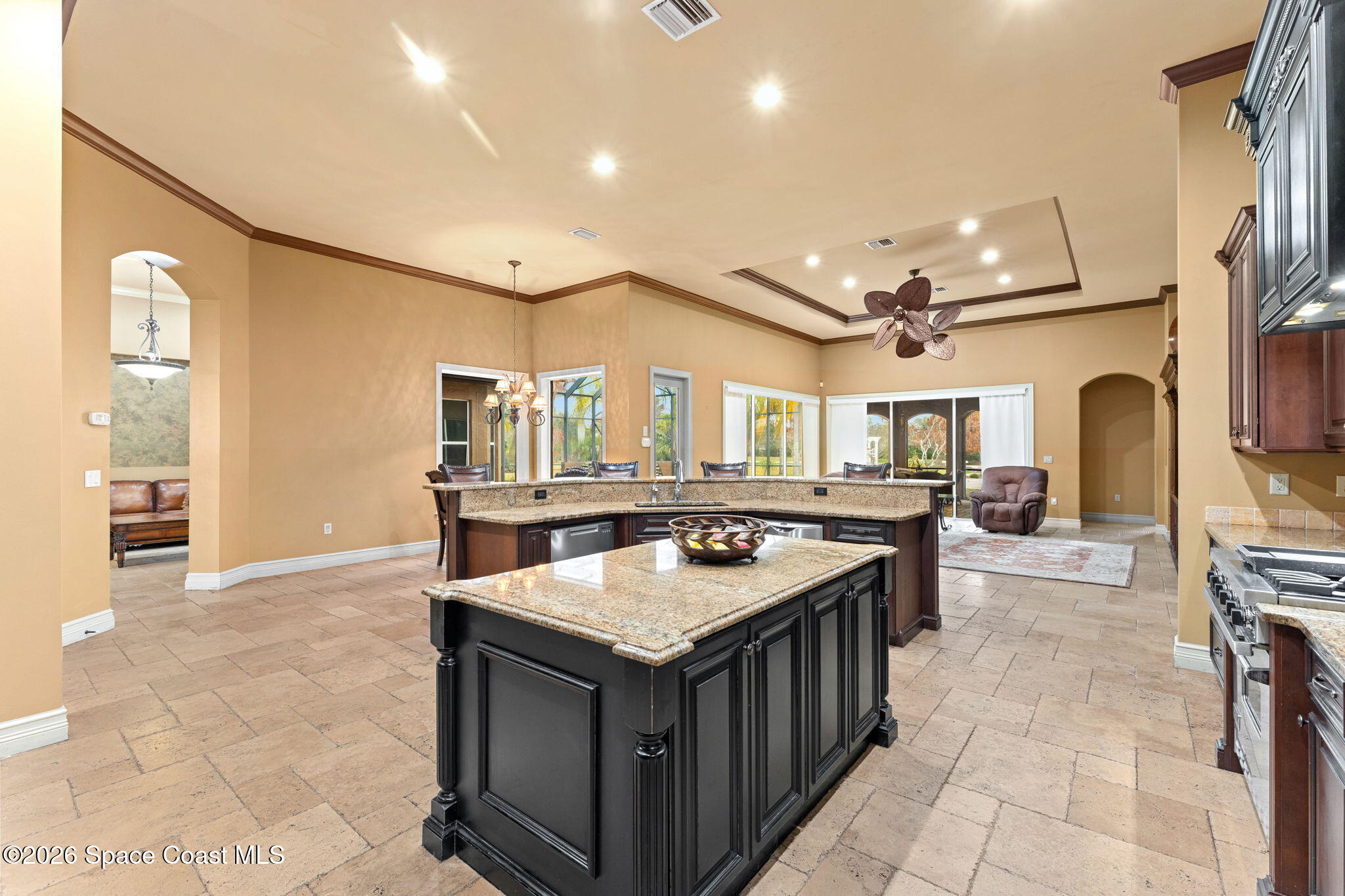 5137 Royal Paddock Way Merritt Island, FL 32953 - Photo 26 of 132 a kitchen with stainless steel appliances granite countertop a stove and a sink