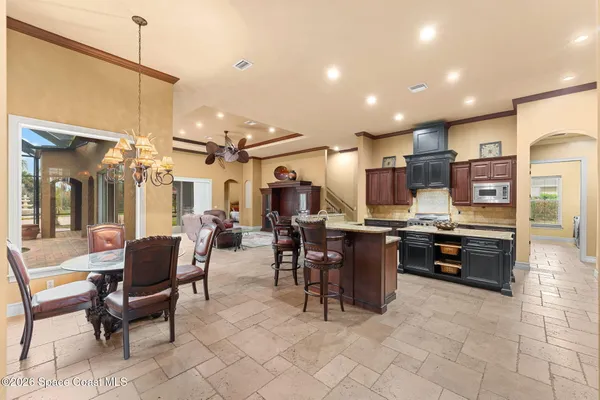 a kitchen with stainless steel appliances granite countertop a stove and a refrigerator