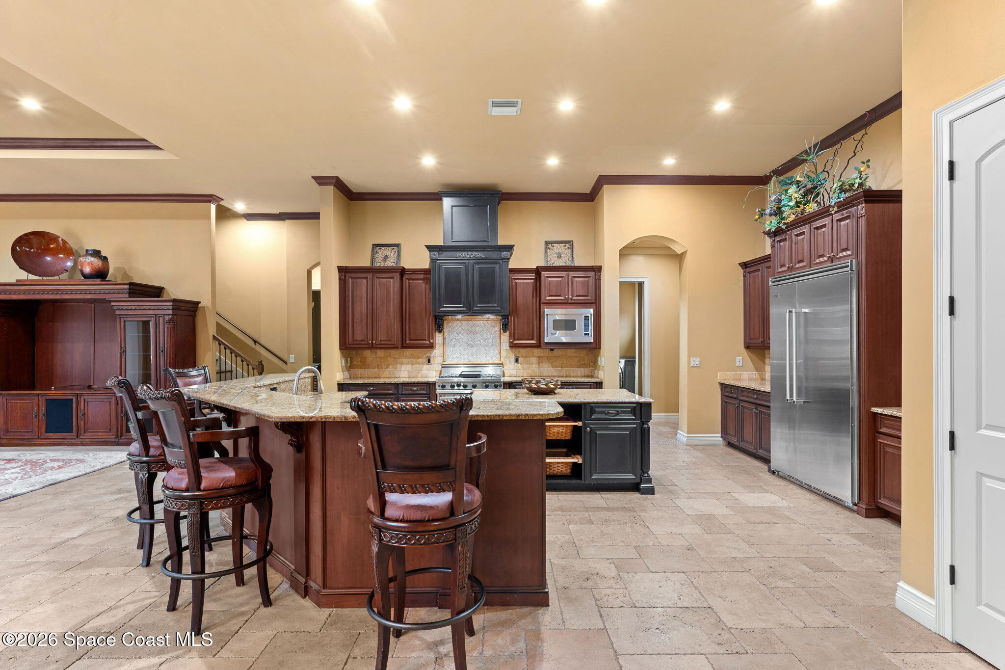 5137 Royal Paddock Way Merritt Island, FL 32953 - Photo 33 of 132 a kitchen with cabinets and chairs
