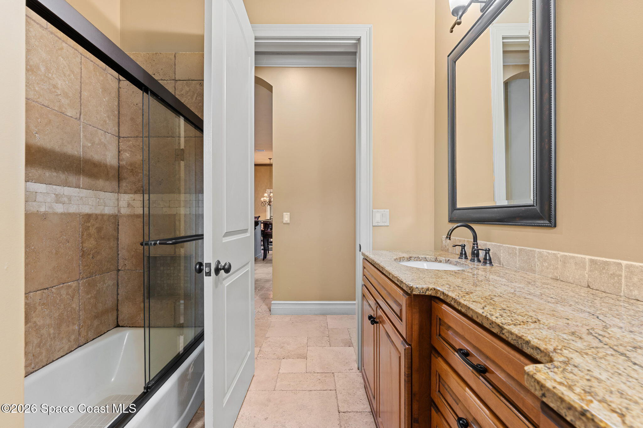 5137 Royal Paddock Way Merritt Island, FL 32953 - Photo 45 of 132 a bathroom with a granite countertop sink a mirror and shower