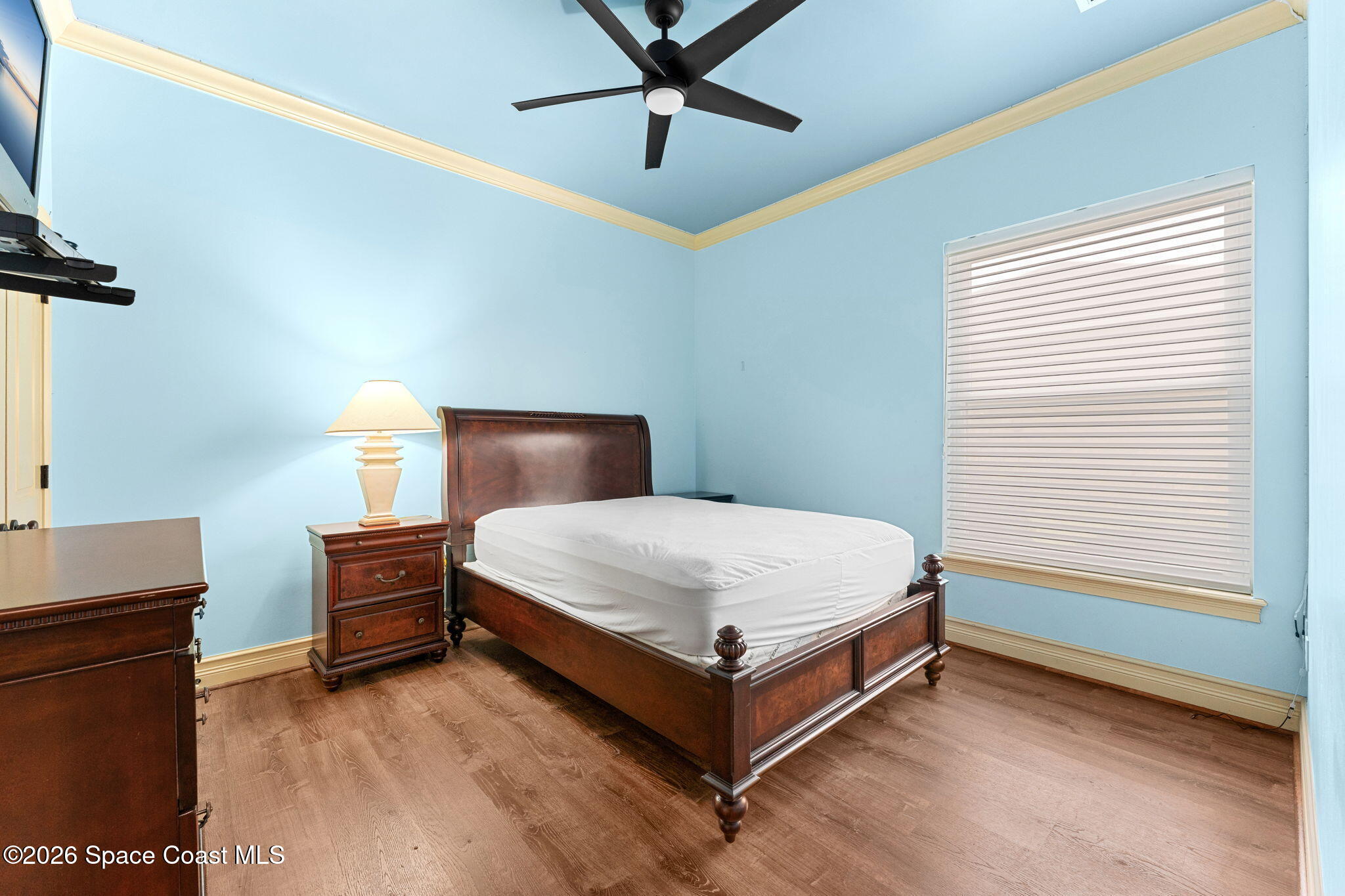 5137 Royal Paddock Way Merritt Island, FL 32953 - Photo 57 of 132 a bedroom with a bed and a chandelier