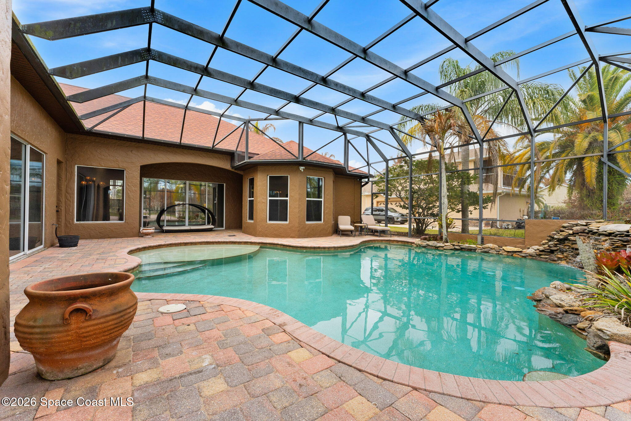 5137 Royal Paddock Way Merritt Island, FL 32953 - Photo 79 of 132 a view of a backyard with swimming pool