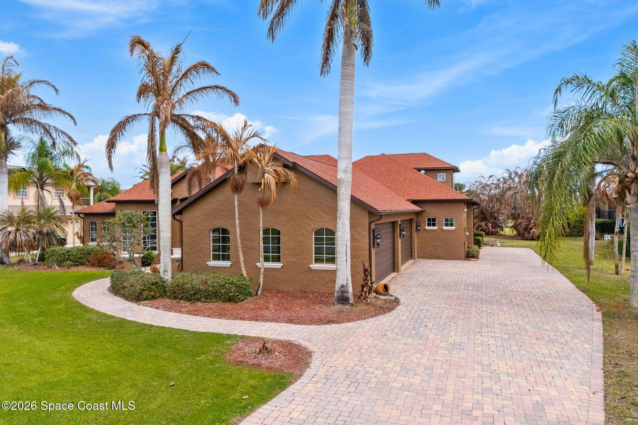 5137 Royal Paddock Way Merritt Island, FL 32953 - Photo 100 of 132 a front view of a house with a yard