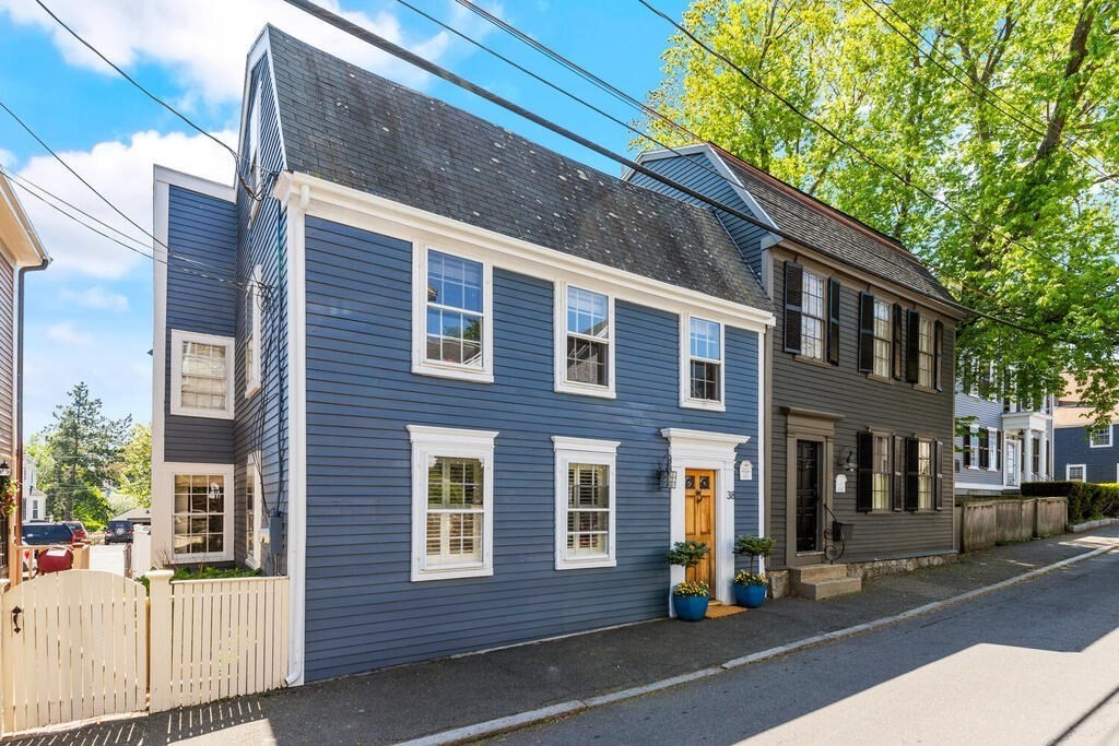 a view of a brick building with many windows