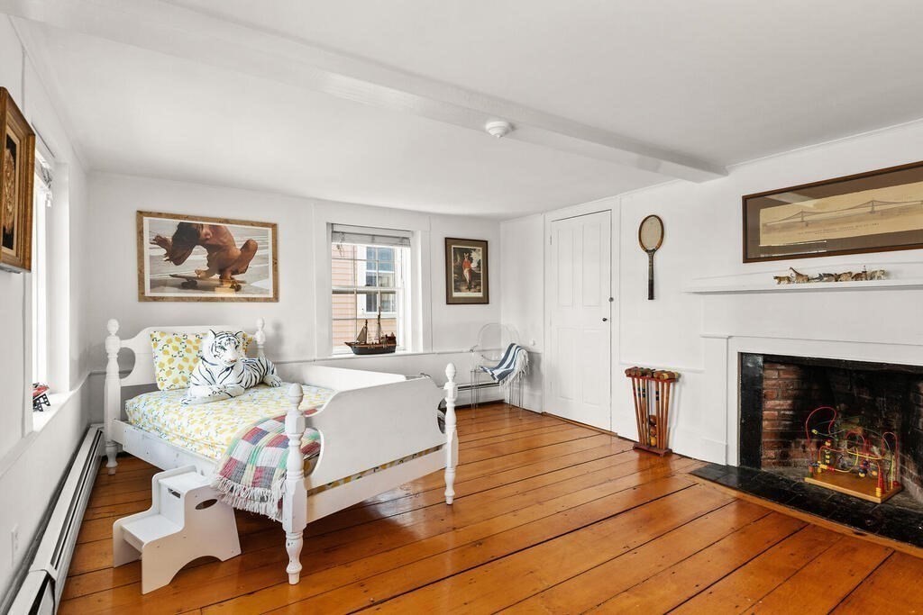 38 Washington Street Marblehead, MA 01945 - Photo 17 of 32 a living room with furniture fireplace and window
