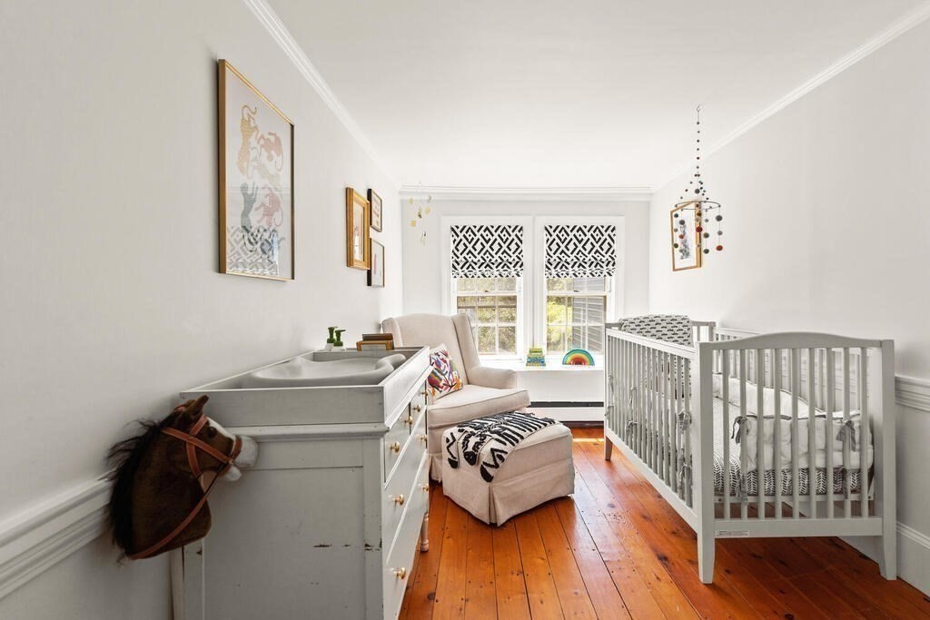 38 Washington Street Marblehead, MA 01945 - Photo 19 of 32 a bedroom with furniture and a window
