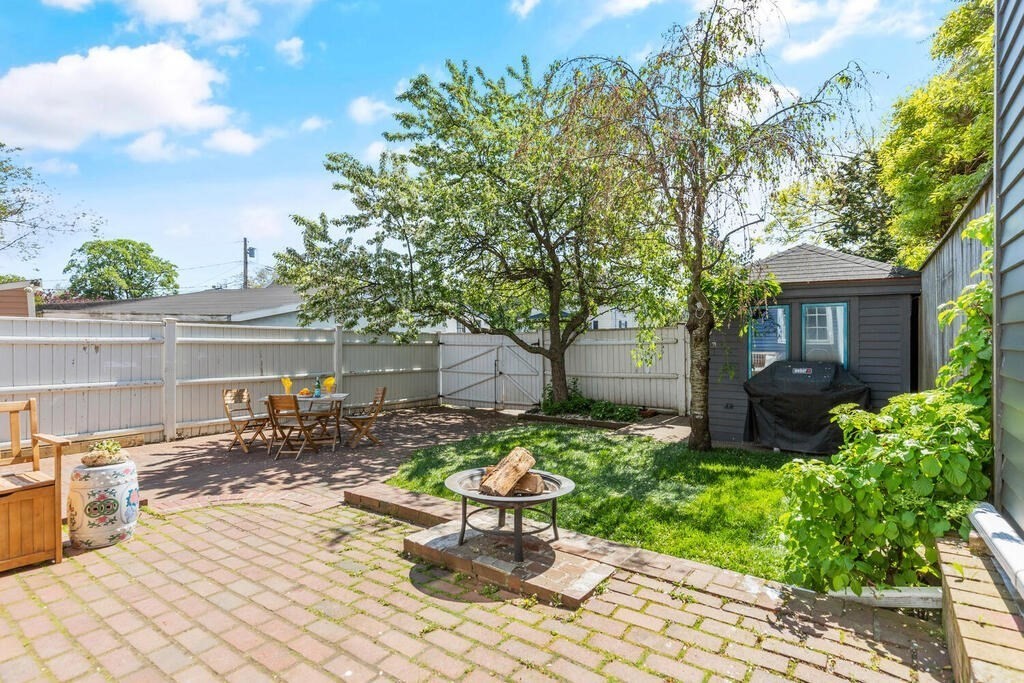 38 Washington Street Marblehead, MA 01945 - Photo 28 of 32 a view of a chair and table in backyard of the house
