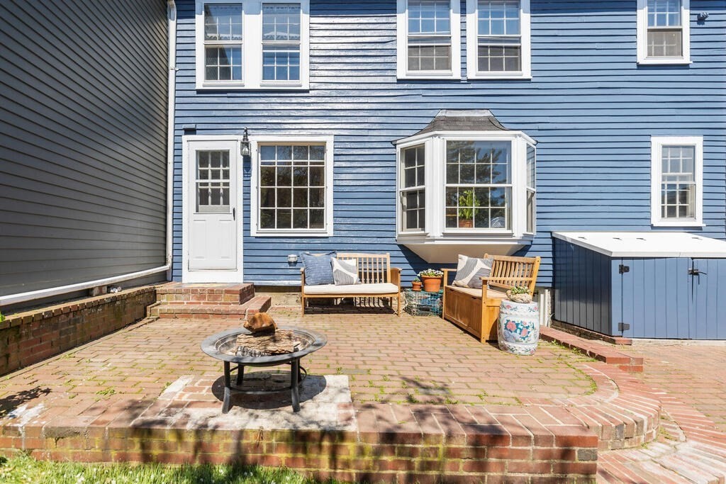38 Washington Street Marblehead, MA 01945 - Photo 29 of 32 a front view of a house with outdoor seating