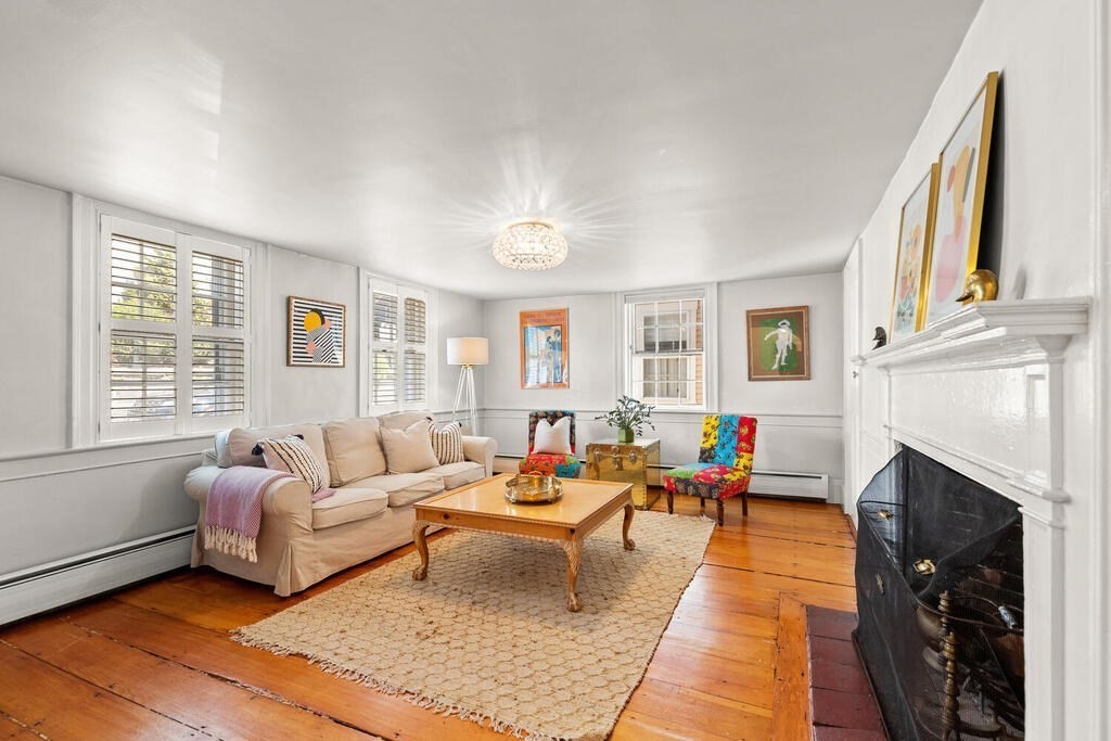 38 Washington Street Marblehead, MA 01945 - Photo 5 of 32 a living room with furniture a fireplace and a window
