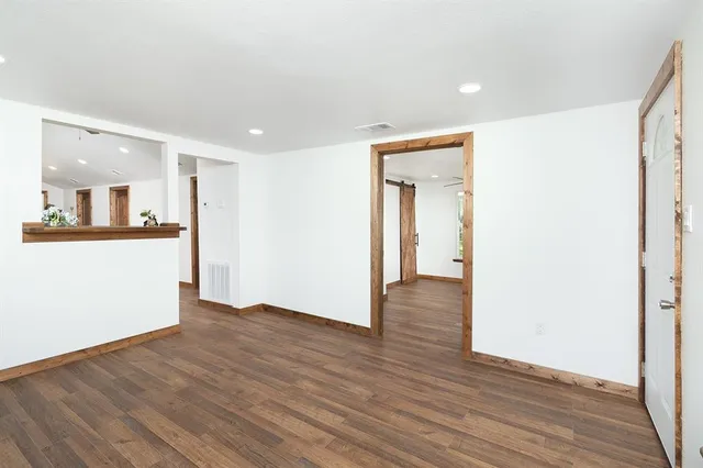a view of a kitchen cabinets and wooden floor
