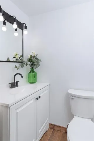a bathroom with a toilet and a sink