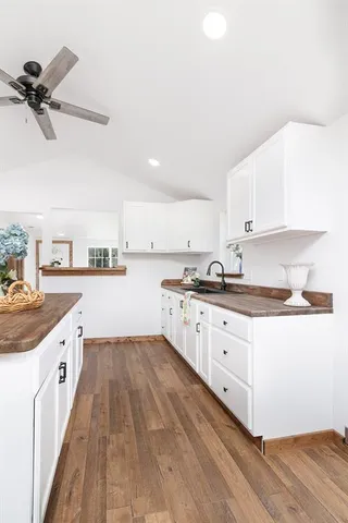 a kitchen with sink cabinets and window