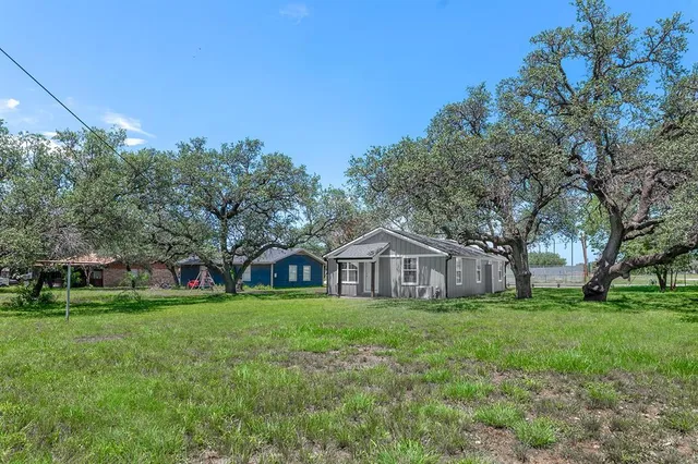 a view of a house with a big yard