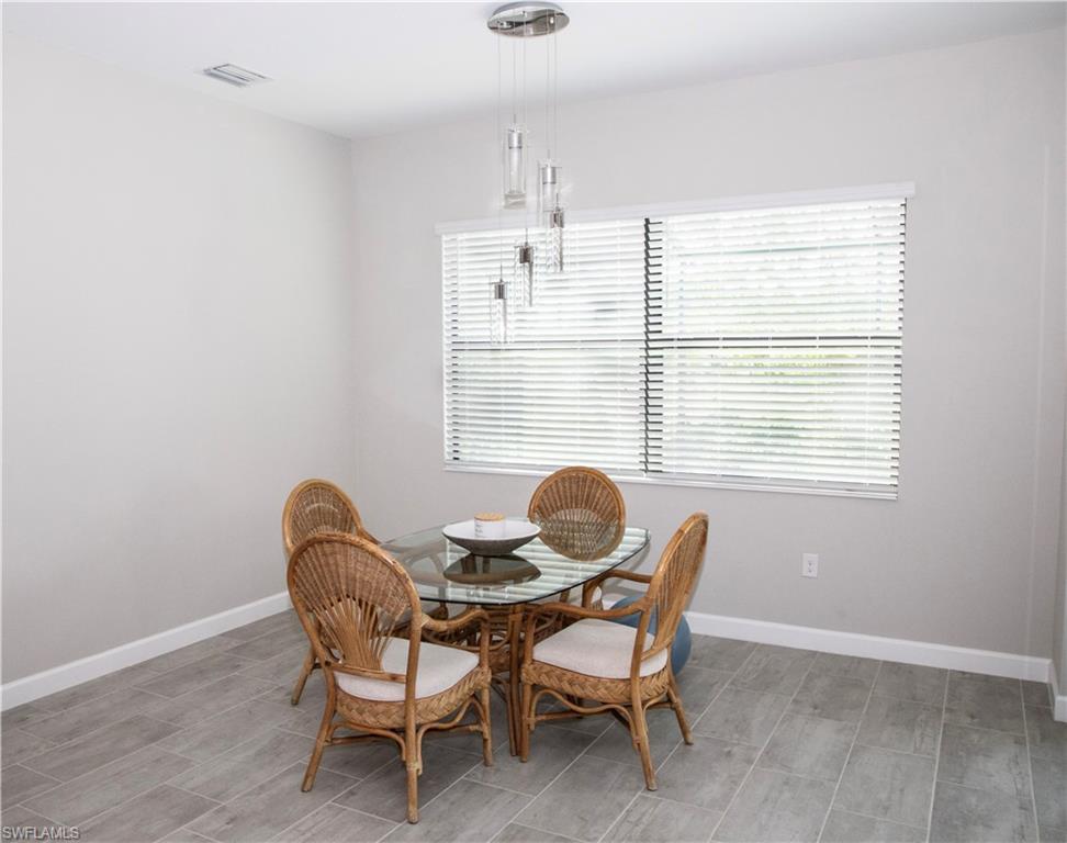 11726 Canopy Loop Fort Myers, FL 33913 - Photo 12 of 40 Dining area with baseboards