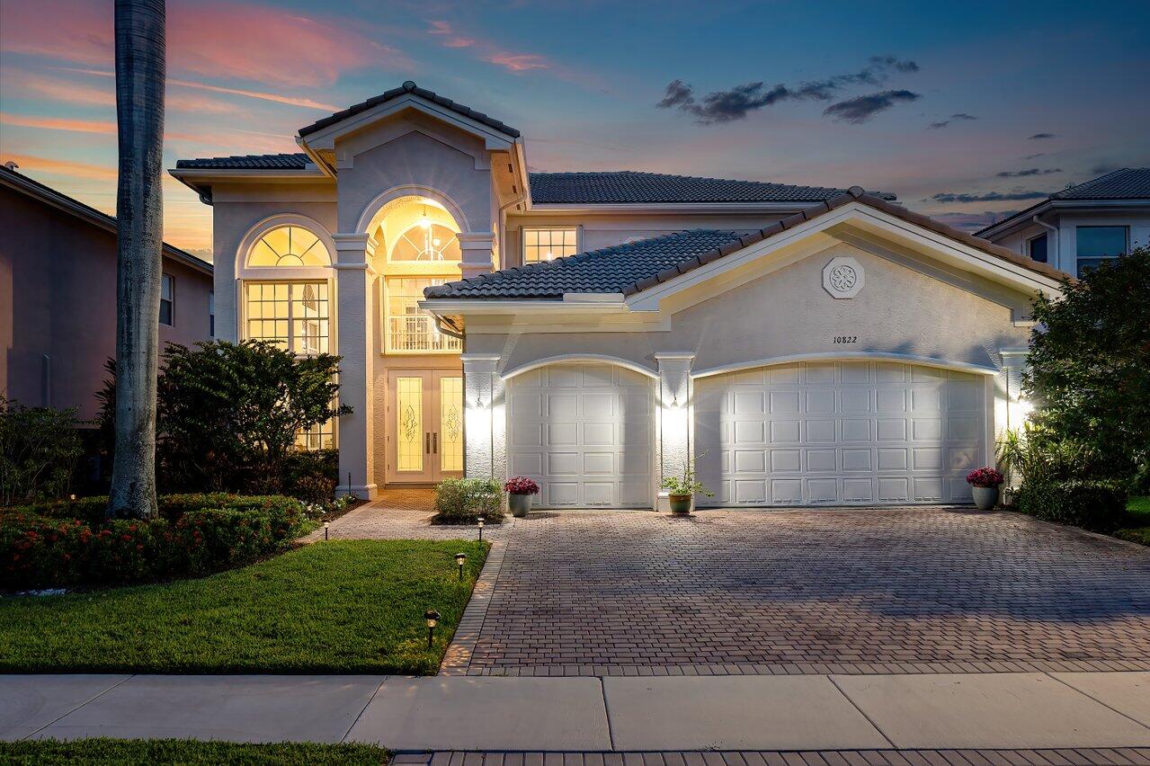 10822 Sunset Ridge Circle Boynton Beach, FL 33473 - Photo 1 of 99 a front view of a house with a yard