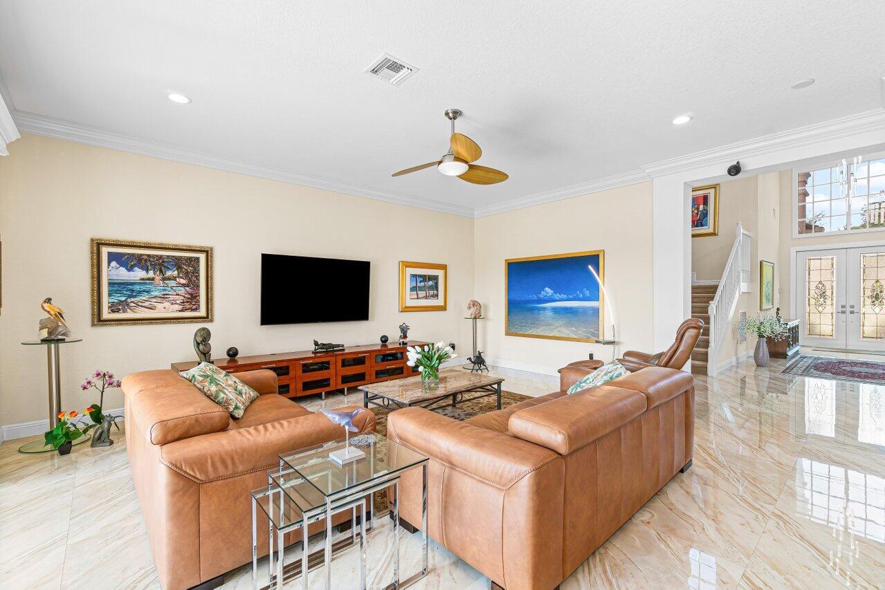 10822 Sunset Ridge Circle Boynton Beach, FL 33473 - Photo 11 of 99 a living room with furniture and a flat screen tv