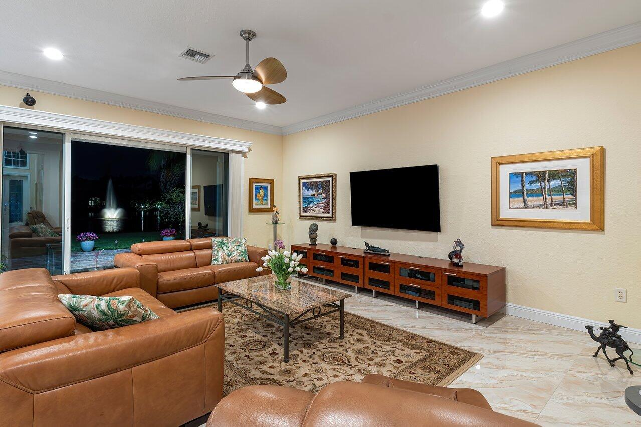 10822 Sunset Ridge Circle Boynton Beach, FL 33473 - Photo 13 of 99 a living room with furniture and a flat screen tv