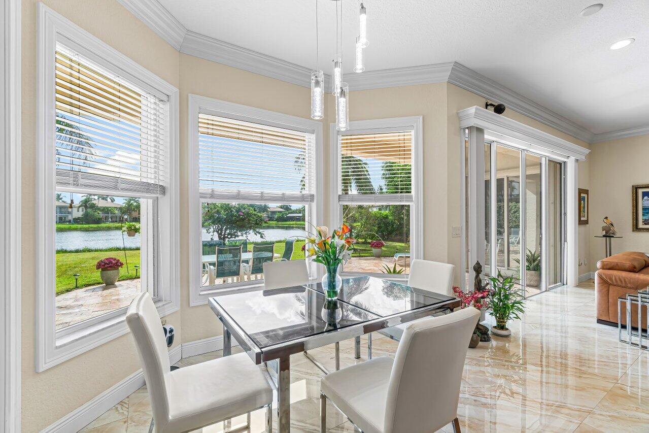 10822 Sunset Ridge Circle Boynton Beach, FL 33473 - Photo 14 of 99 a view of a dining room with furniture window and outside view