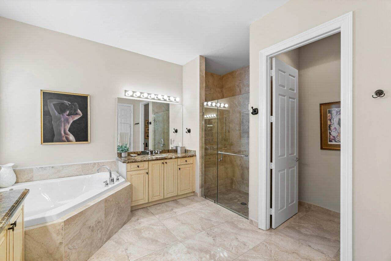 10822 Sunset Ridge Circle Boynton Beach, FL 33473 - Photo 27 of 99 a bathroom with a bathtub and a shower