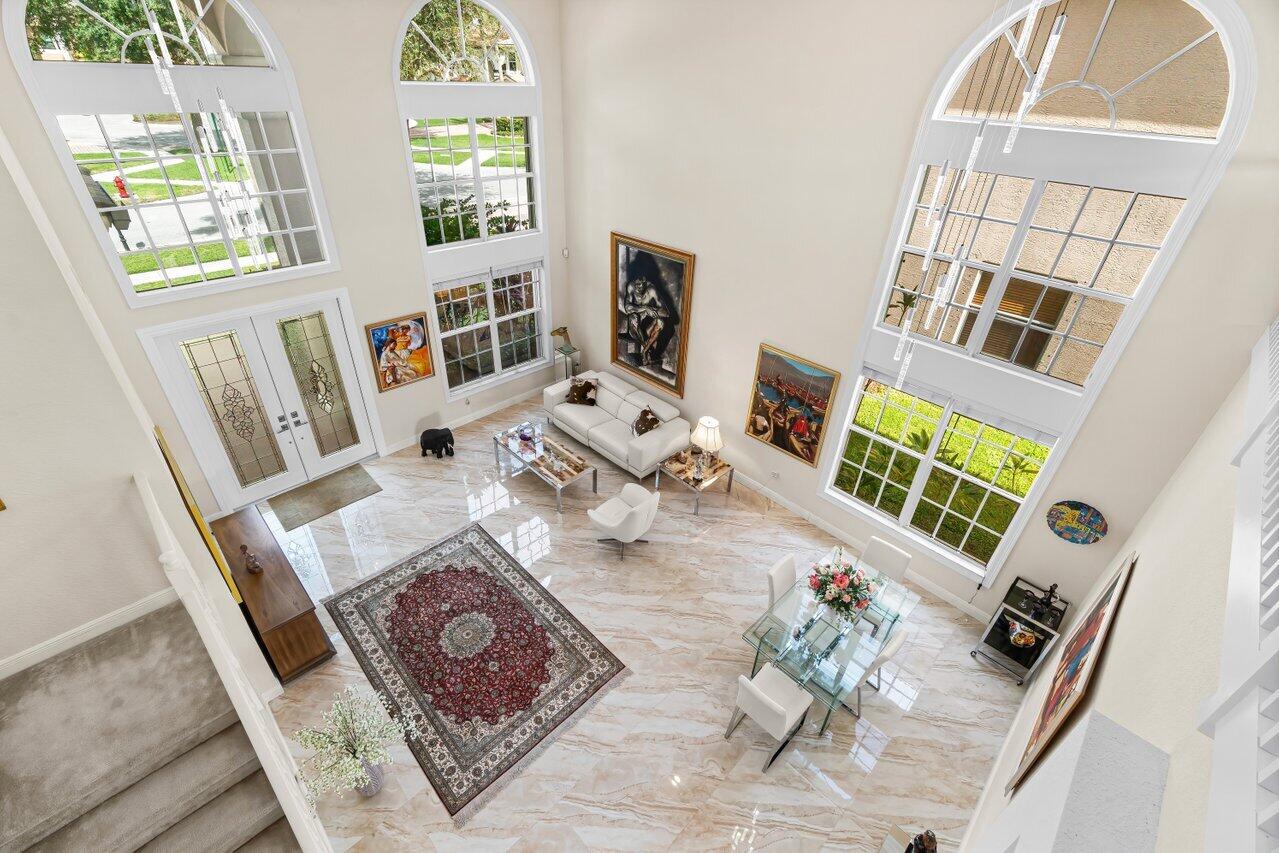 10822 Sunset Ridge Circle Boynton Beach, FL 33473 - Photo 31 of 99 a living room with furniture and a window