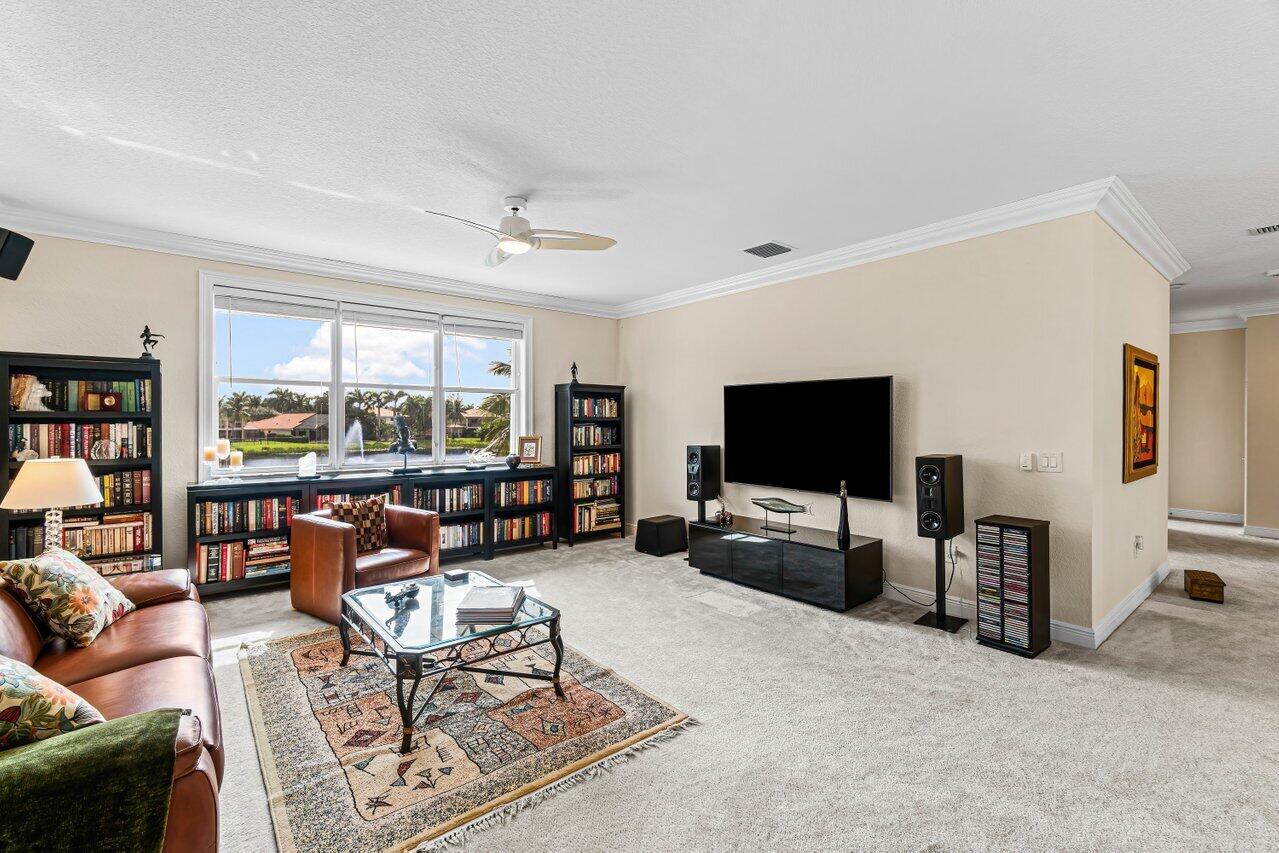 10822 Sunset Ridge Circle Boynton Beach, FL 33473 - Photo 34 of 99 a living room with furniture and a flat screen tv