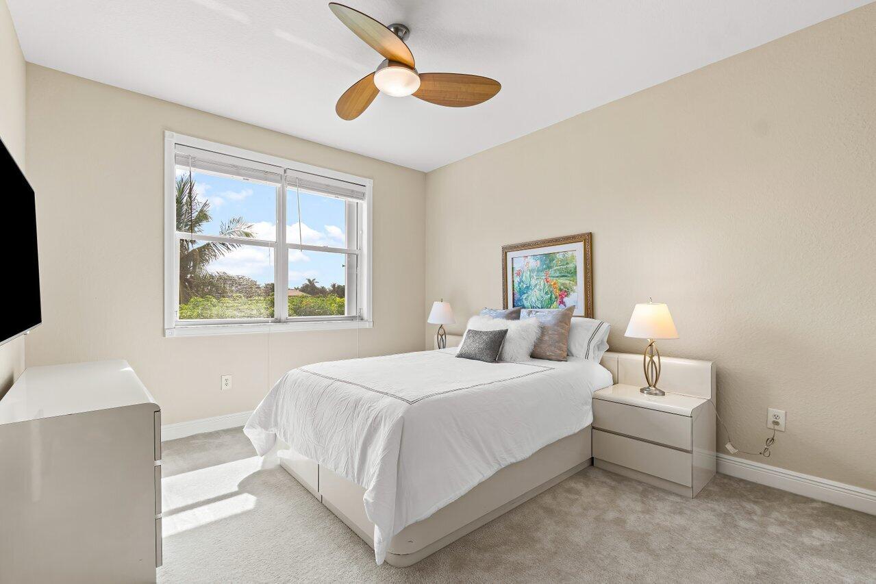 10822 Sunset Ridge Circle Boynton Beach, FL 33473 - Photo 44 of 99 a bedroom with a bed and a window