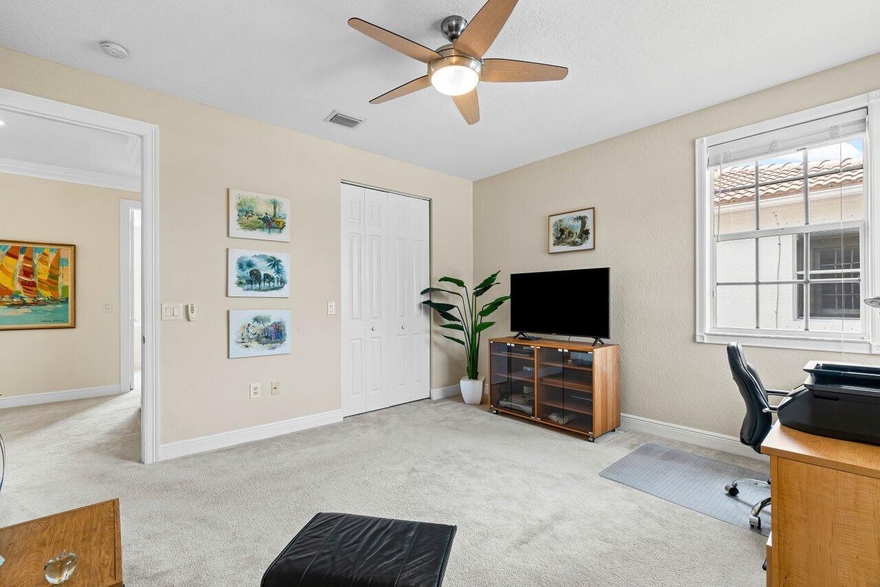 10822 Sunset Ridge Circle Boynton Beach, FL 33473 - Photo 49 of 99 a living room with furniture and a flat screen tv