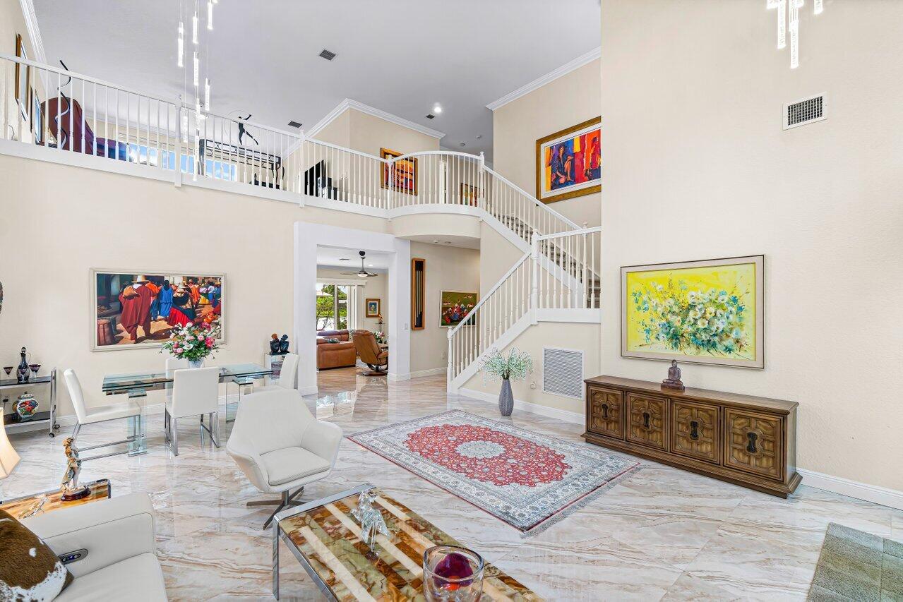 10822 Sunset Ridge Circle Boynton Beach, FL 33473 - Photo 7 of 99 a living room with furniture and a flat screen tv
