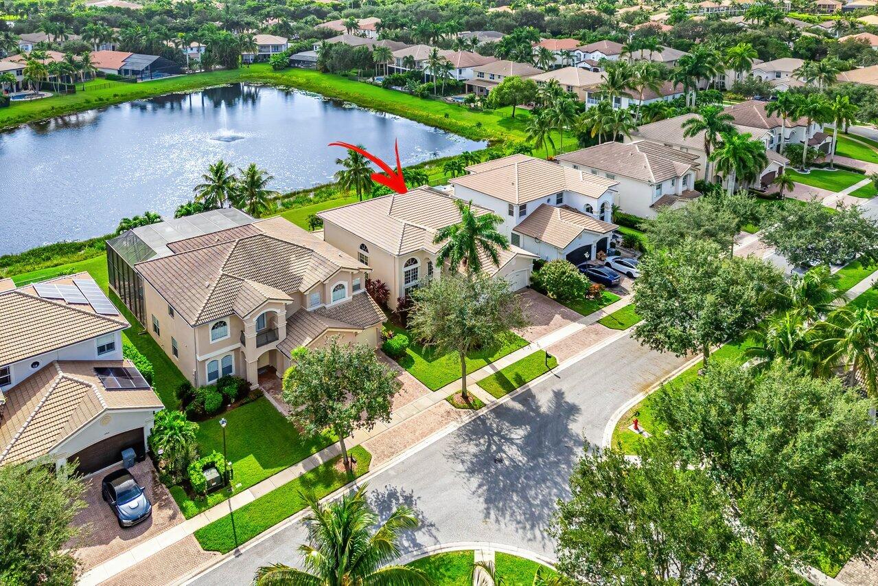 10822 Sunset Ridge Circle Boynton Beach, FL 33473 - Photo 76 of 99 an aerial view of a house with a lake view
