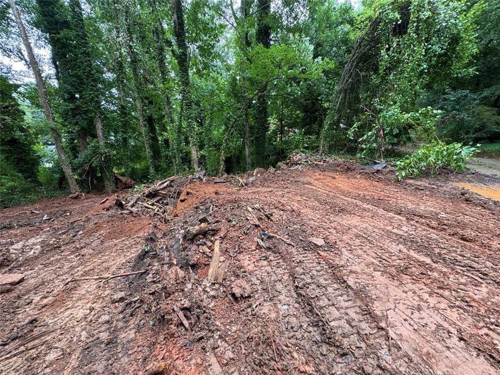 3230 Kelly Street Scottdale, GA 30079 - Photo 3 of 5 a wooden bench with view of trees
