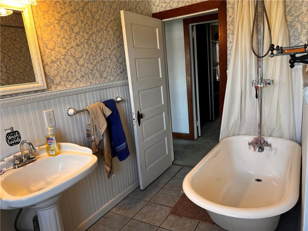 110 Walters Street Derry, PA 15627 - Photo 12 of 16 a bathroom with a sink and mirror